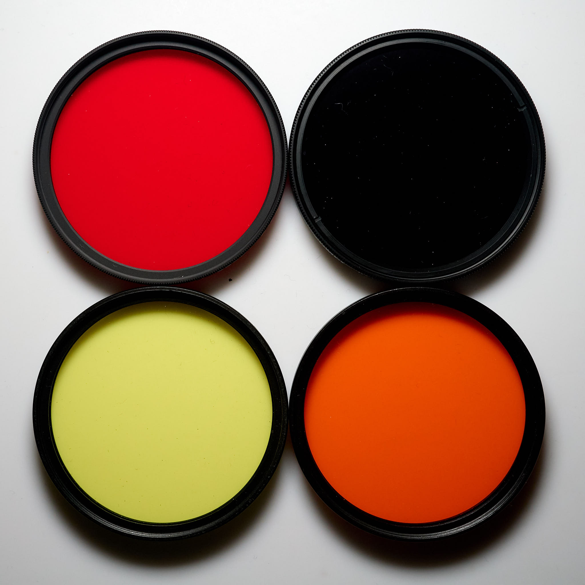 Four long-pass glass filters, yellow, orange, red and NIR